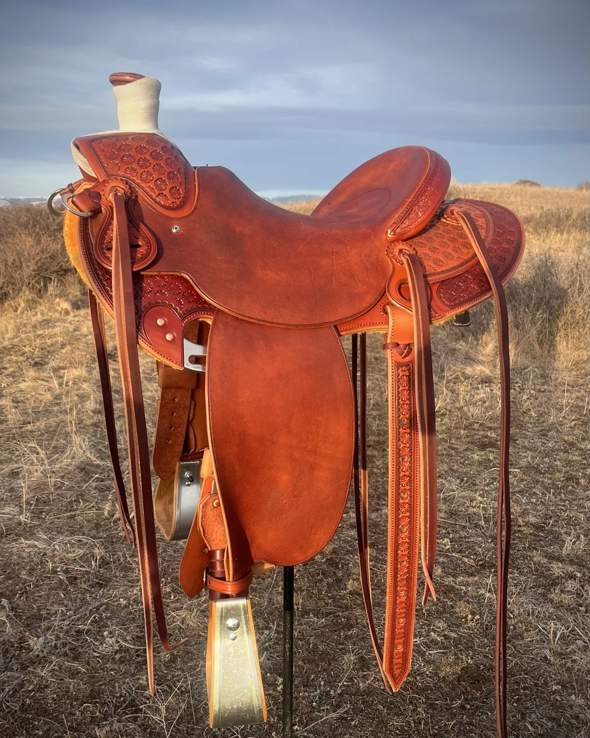 Finished saddle photographed outdoors on the Wyoming prairie