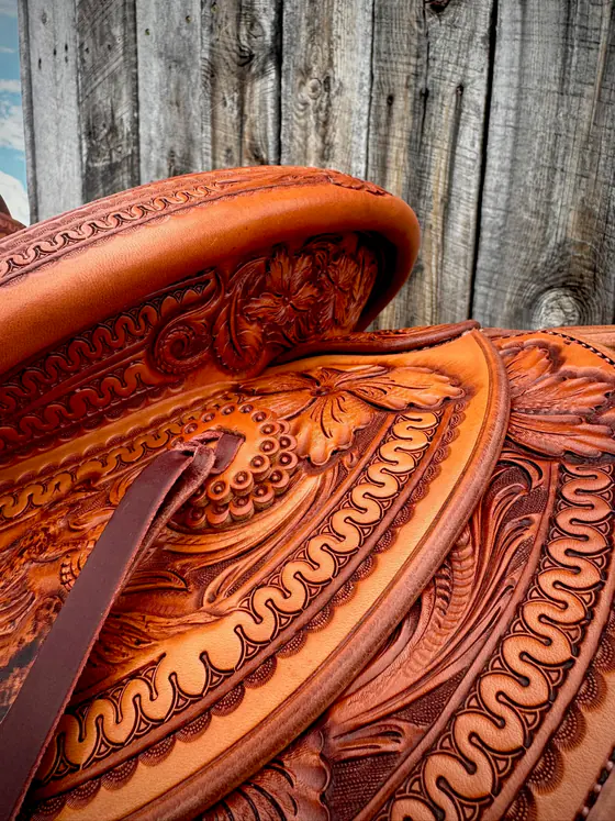 Carved cantle binding and tooled jockeys seen from above on a custom saddle
